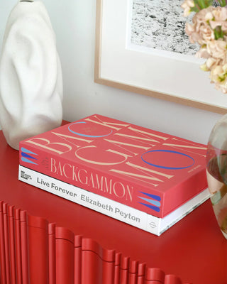 Backgammon coffee table book on a red unit