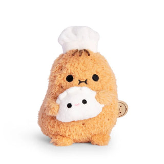 Plush toy resembling a potato in a chef's outfit holding a dumpling on a white background