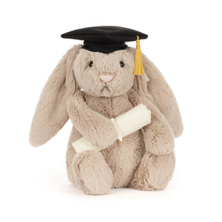 Plush bunny toy wearing a graduation cap and holding a scroll on a white background
