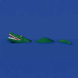 full body of 3d paper crocodile against a blue background