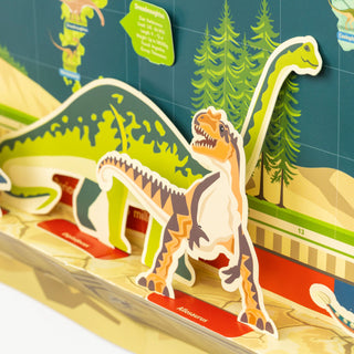 zoomed in view of a 2 paper dinosaurs on the base of the timeline