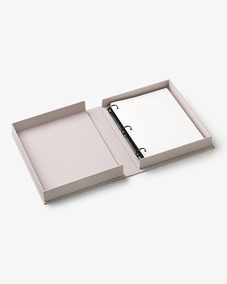 Open grey photo album box with black ring binder and plain white pages
