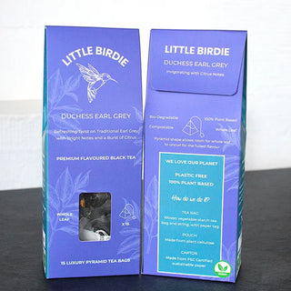 Two boxes of Little Birdie Duchess Earl Grey tea on a dark surface with a light background