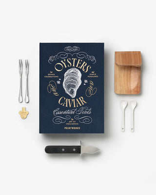 Oysters & Caviar display book and tools against a white background