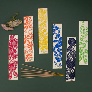 Set of floral and botanical bookmarks on a dark green background