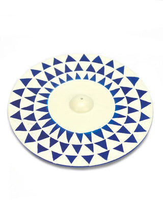Round ceramic plate with blue and white geometric pattern on a white background