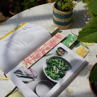 Open book with multiple bookmarks with floral decoration