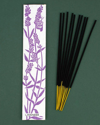 Incense sticks with lavender design packaging on a green background