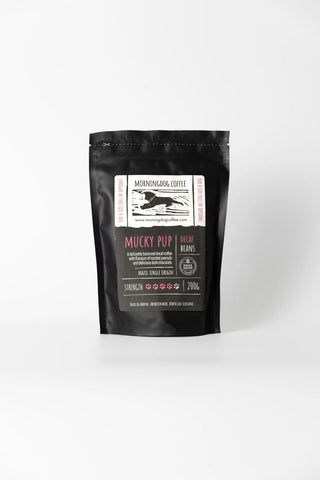 Black coffee packaging with a label on a white background