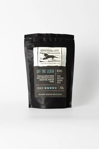 Black coffee packaging with a label on a white background