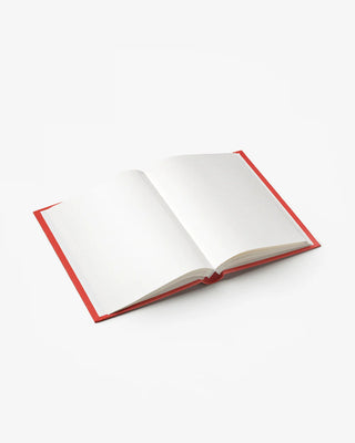 Open book with red edges and plain white pages on a white background