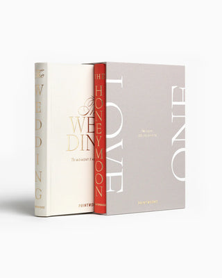Two books titled 'Honeymoon' and 'wedding' in a 'One Love' display box on a white background