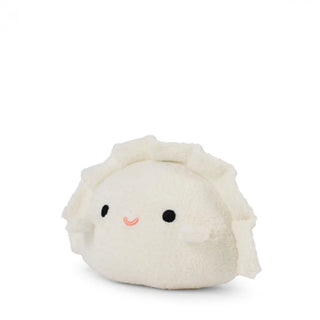 Plush toy resembling a dumpling with a smiling face on a white background