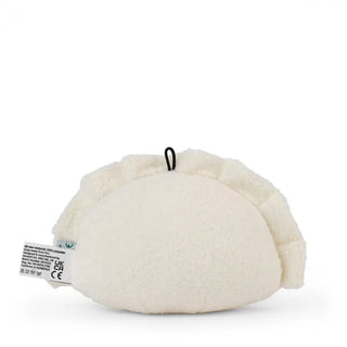 White plush toy with a tag on a white background