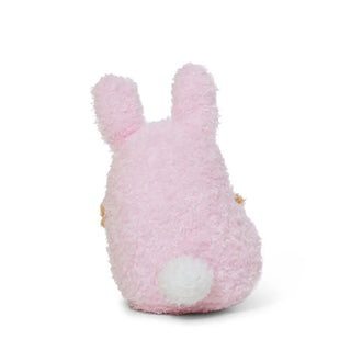Back view of a Potato plush toy dressed as a pink bunny against a white background