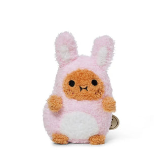 Potato plush toy dressed as a pink bunny against a white background