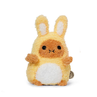 front view of a plush potato toy dressed as a yellow bunny on a white background