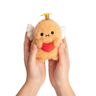 Plush toy resembling a cupid with a red heart held by hands on a white background