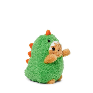 Side view of a plush potato dressed as a green dinosaur with orange spikes and horn against a white background