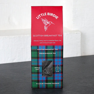 Box of Little Birdie Scottish Breakfast Tea on a dark surface with a white background