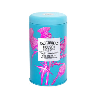 Blue cylindrical tin with pink thistle design and 'Shortbread House Edinburgh' label on a white background