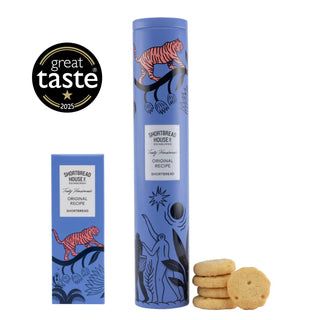 Blue cylindrical packaging with decorative elements and a stack of shortbread rounds on a white background with a Great Taste Award 2025 badge