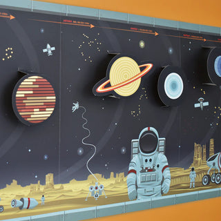 zoomed in view of the build your own solar system set against an orange background