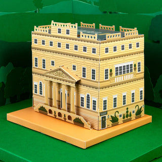 3d paper model of a stately home against a green background