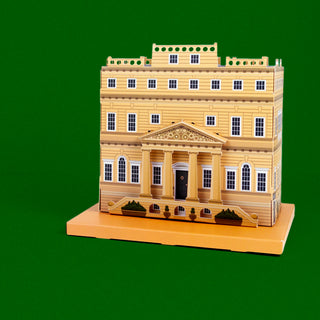 Front side of the 3d paper stately home against a green background