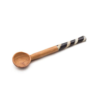 Wooden spoon with a black and white striped handle on a white background