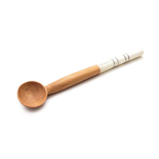 Wooden spoon with a white handle on a white background