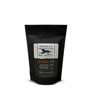 Black coffee bag with a label on a white background