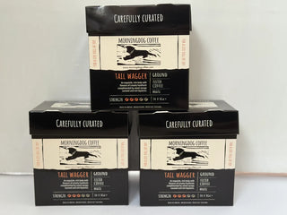 Three stacked boxes of MorningDog Coffee Carefully Curated Tail Wagger Ground Filter Coffee on a white background
