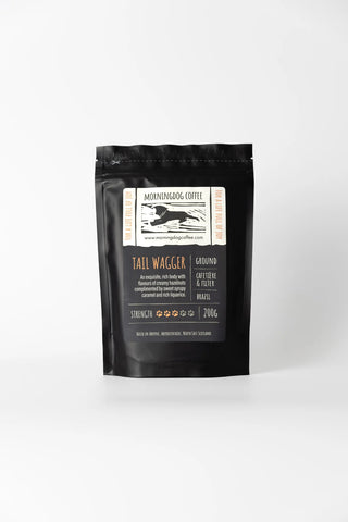 Black coffee bag with a label on a white background