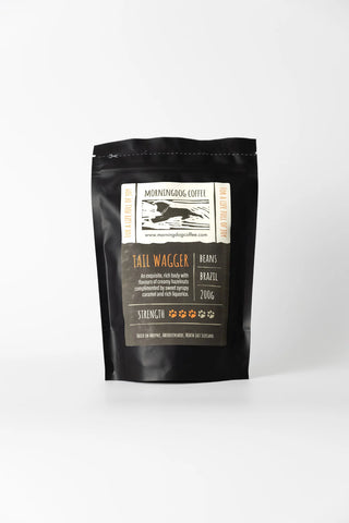 Black coffee packaging with a label on a white background