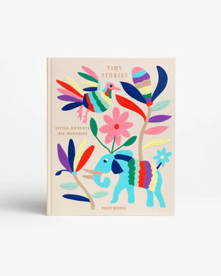 Beige photo album book with multicolour embroidery depicting an elephant, bird and flowers