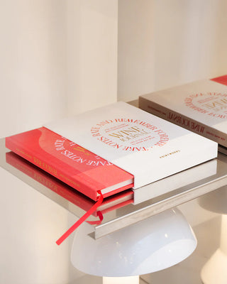 Wine tasting journal on a table surface with a soft focus background