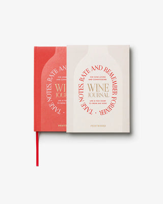 Wine journal with red and white design inside white packaging with red text on a white background