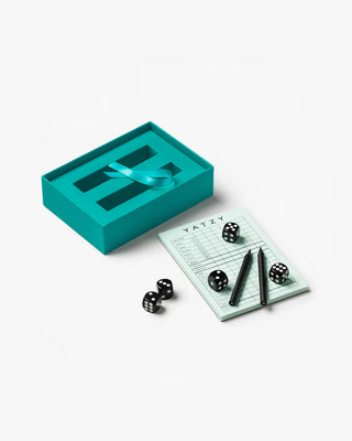 Contents of a teal blue box with dice, pencils and yatzy score sheet